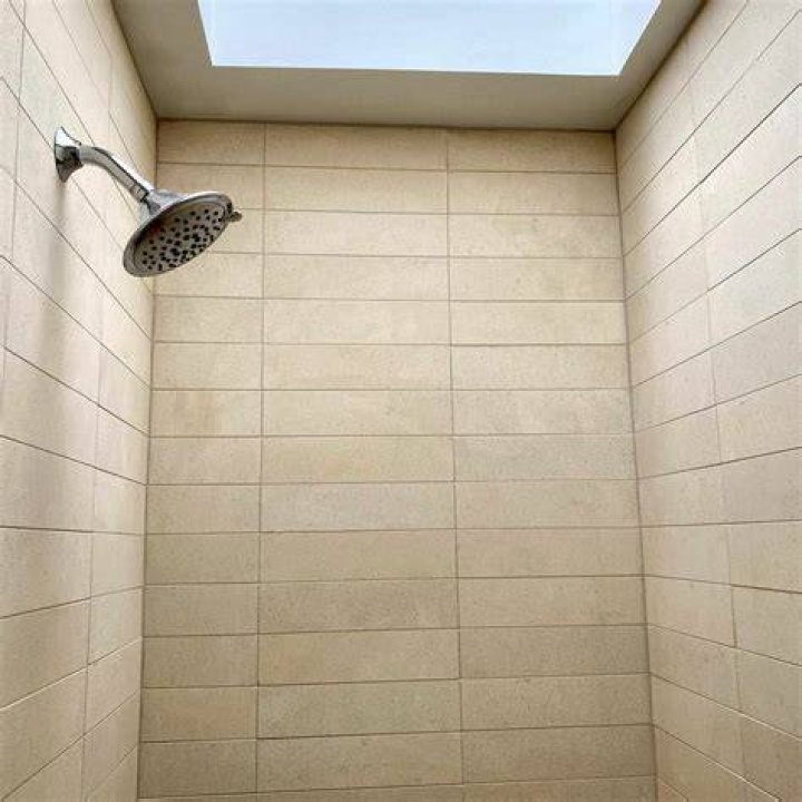 Can limestone tile be used in a shower?