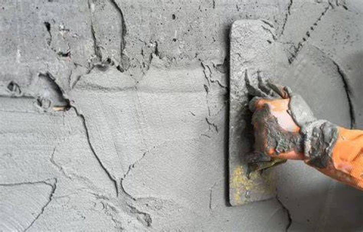 How do you plaster a cement wall?